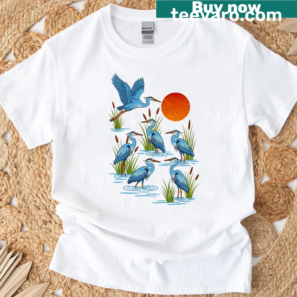 Blue herons silhouette against a red sun t-shirt — on a men's t-shirt