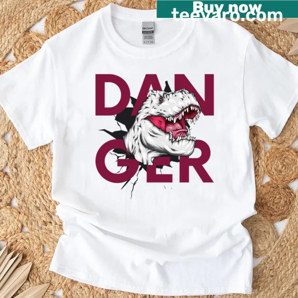 Cartoon dinosaur in a funny danger scenario on a T-shirt
