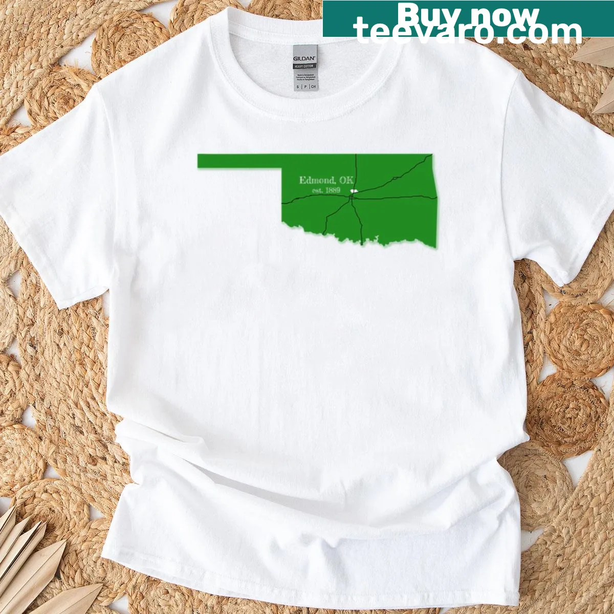 Minimalist Edmond OK text design on a green T-shirt — on a men's t-shirt