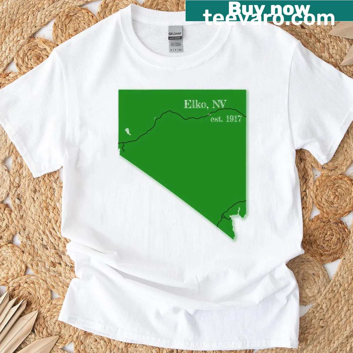 Minimalist Elko, NV typography on a green T-shirt — on a men's t-shirt