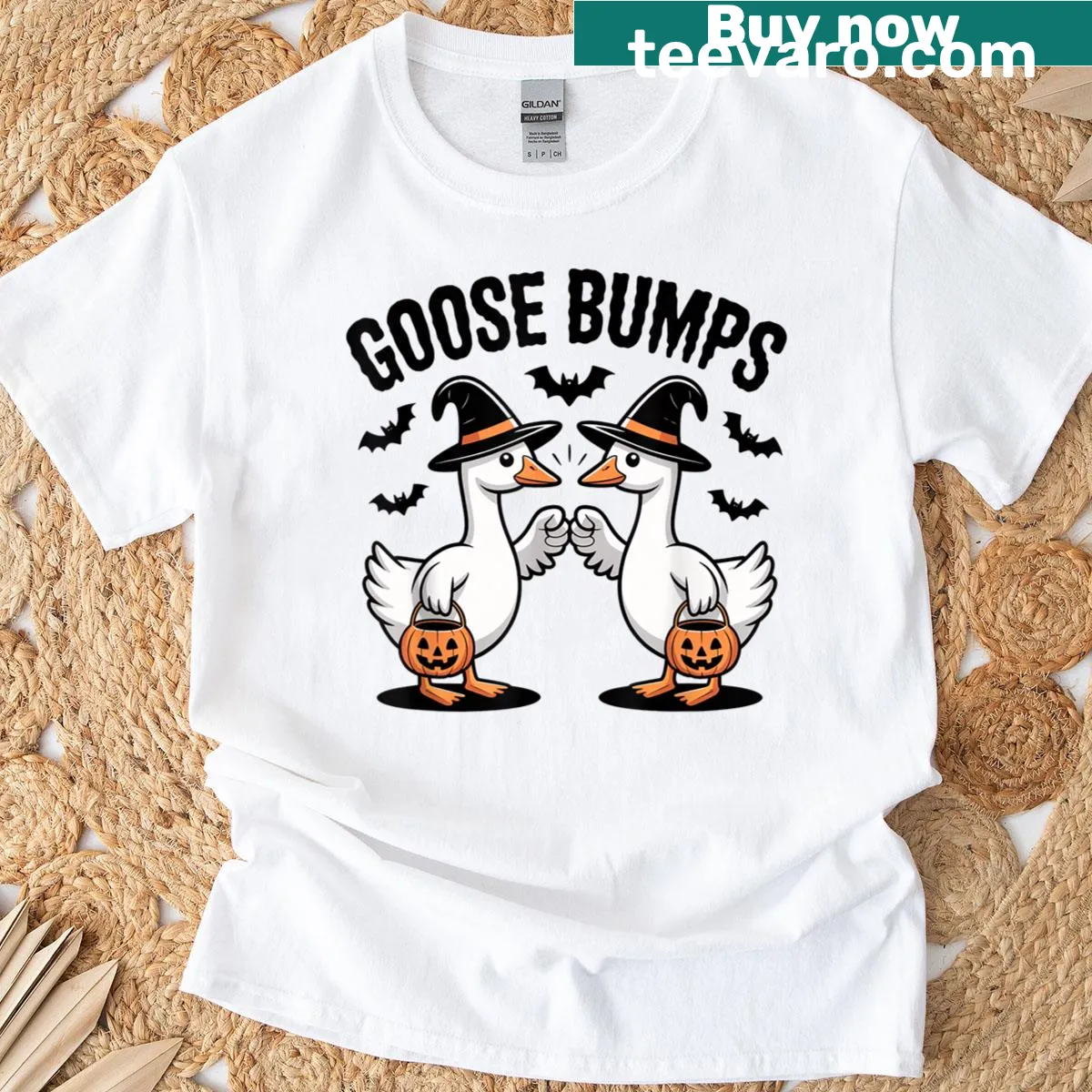Cartoon Halloween T-shirt with a goose, ghost, and pumpkin fist bump — on a men's t-shirt