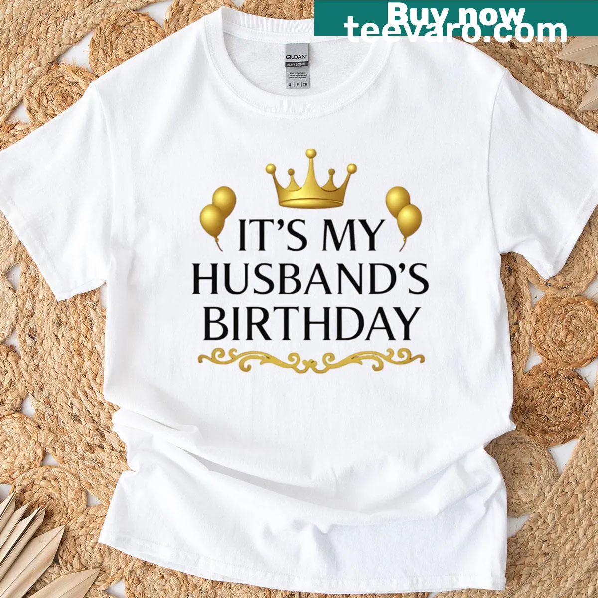 Festive birthday shirt with gold crown and balloon illustrations — on a men's t-shirt