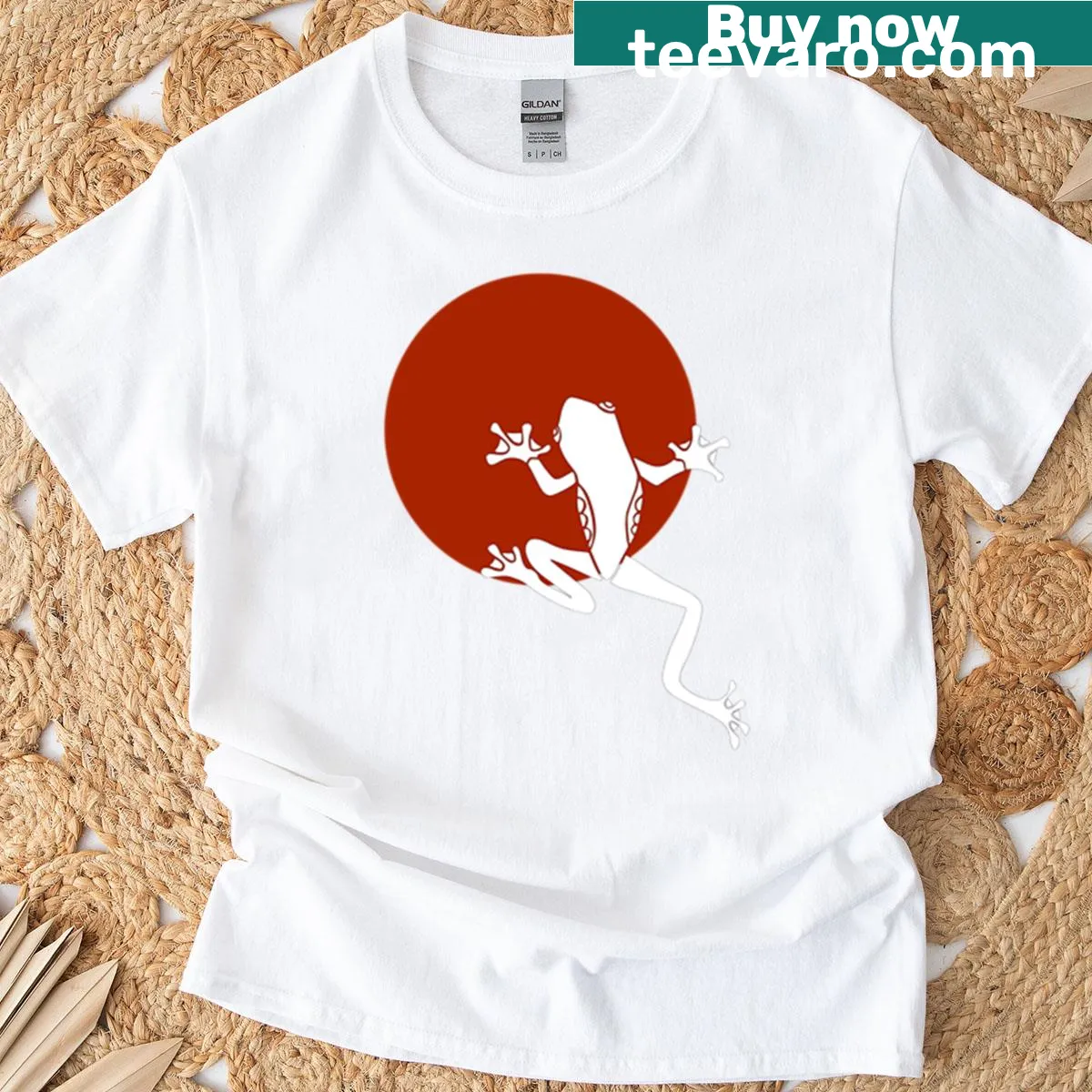 Minimalist frog silhouette on a t-shirt with a red circle background — on a men's t-shirt