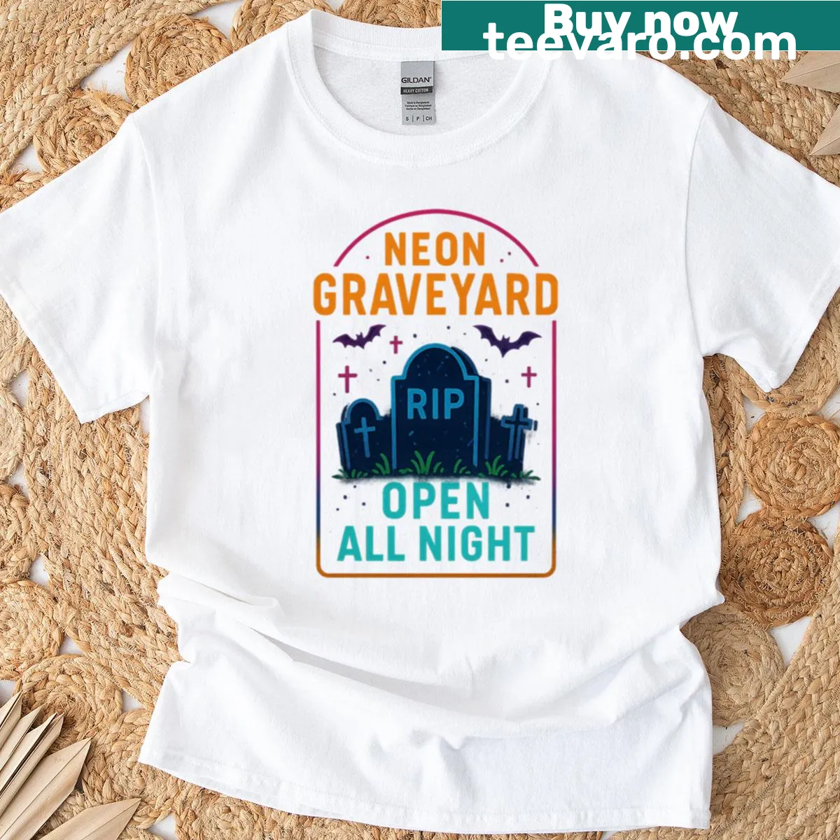 Playful neon graveyard graphic on Halloween T-shirt — on a men's t-shirt