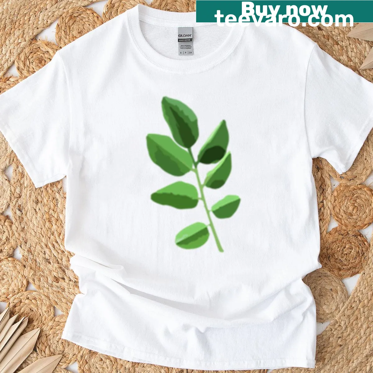 T-shirt featuring vector illustration of green Padauk leaves — on a men's t-shirt
