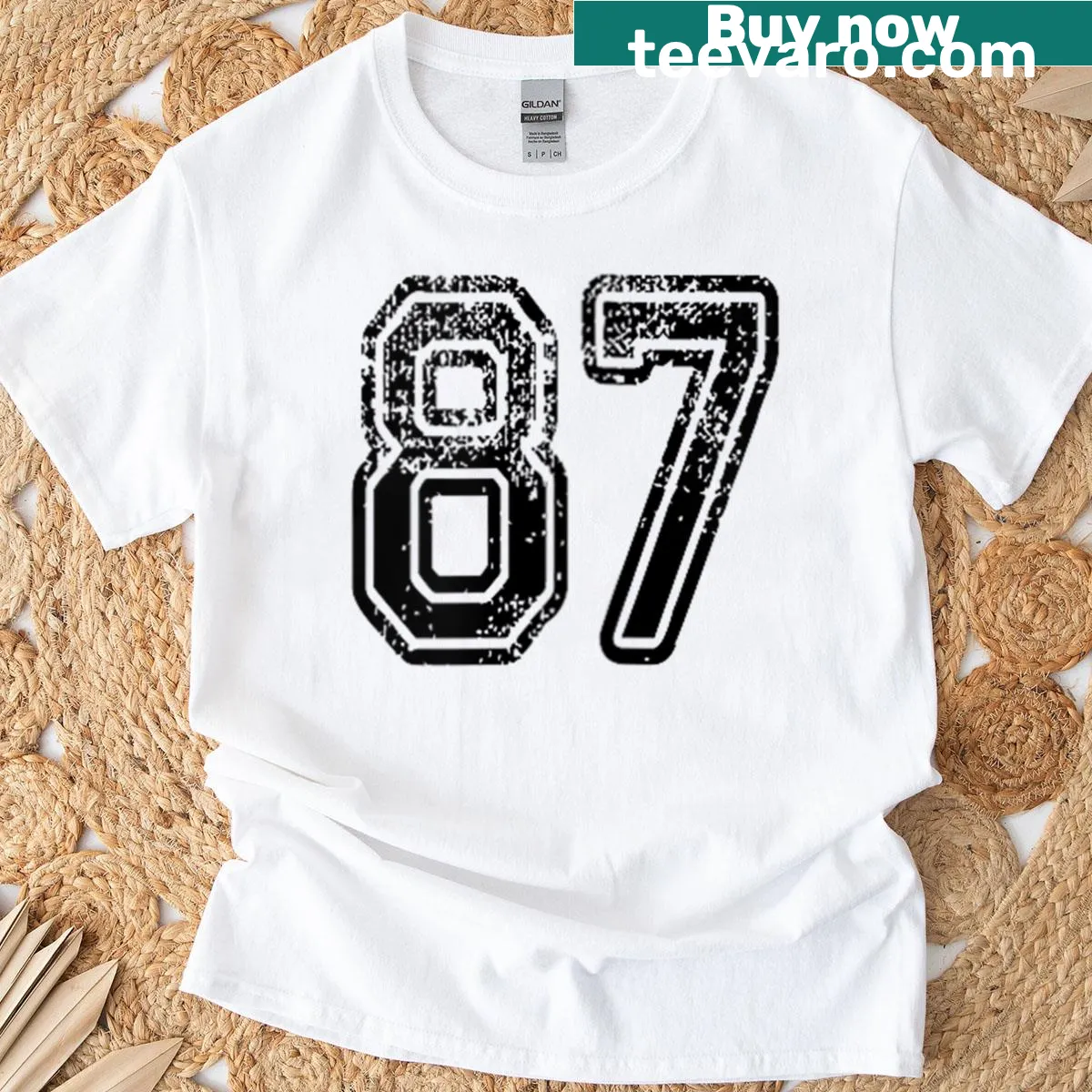 Grungy black T-shirt with distressed number 87 print — on a men's t-shirt