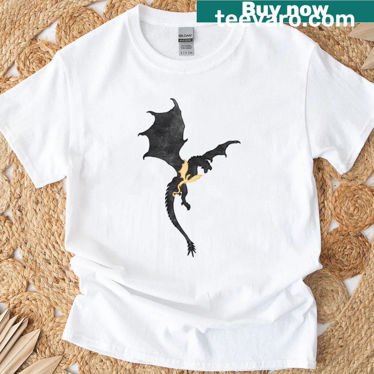 Oversized T-shirt featuring dragon riders and golden feathers illustration — on a men's t-shirt