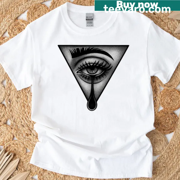 Illustration of a mystical eye with a tear on a T-shirt, symbolizing emotion.