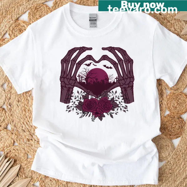 Skeleton hand holding a rose on a Halloween-themed T-shirt