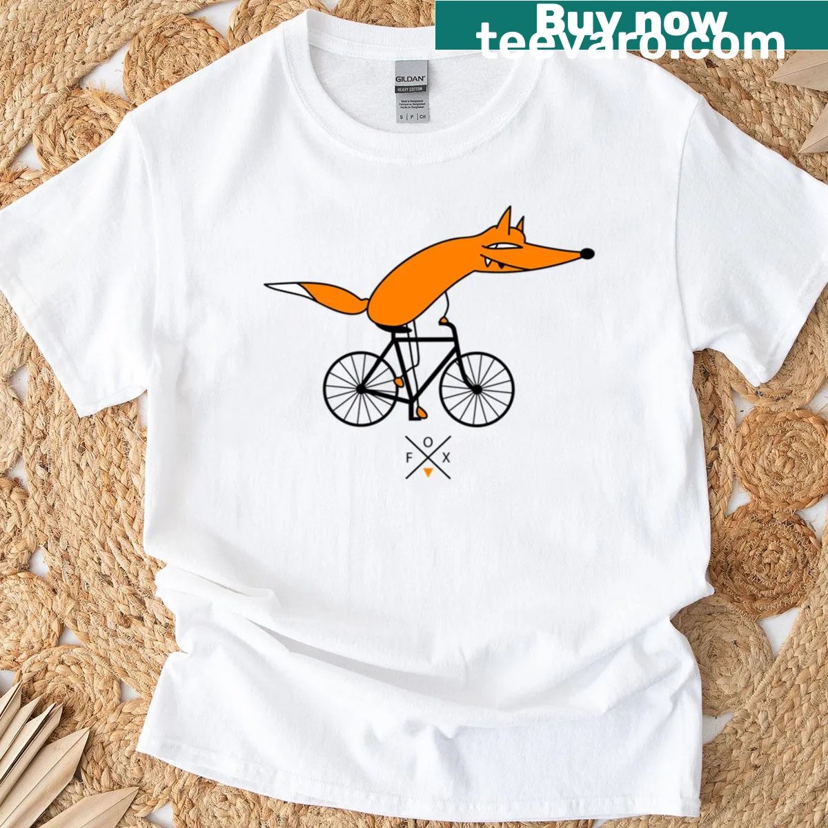 Cartoon fox riding a bicycle on a playful T-shirt — on a men's t-shirt