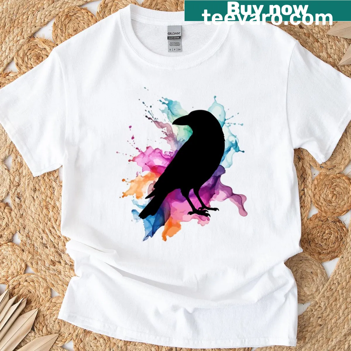 Silhouette of a crow against an abstract color splash — on a men's t-shirt