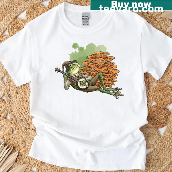 Cute cartoon frog design on a cottage core aesthetic T-shirt.