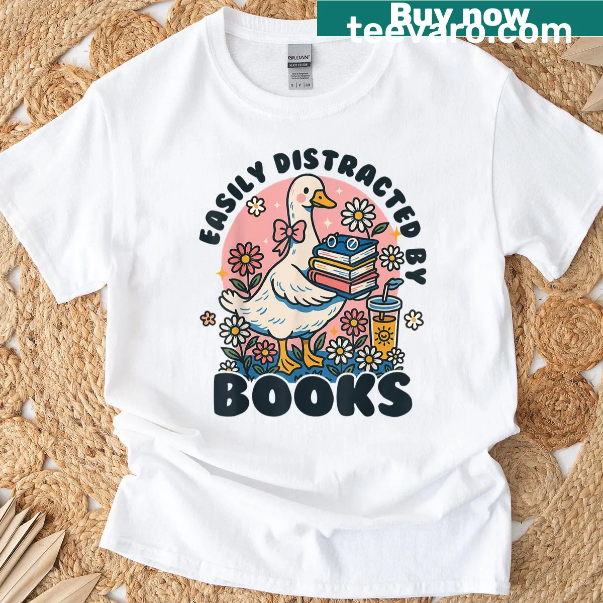 Illustration of a goose surrounded by books, capturing a bookworm's spirit. — on a men's t-shirt