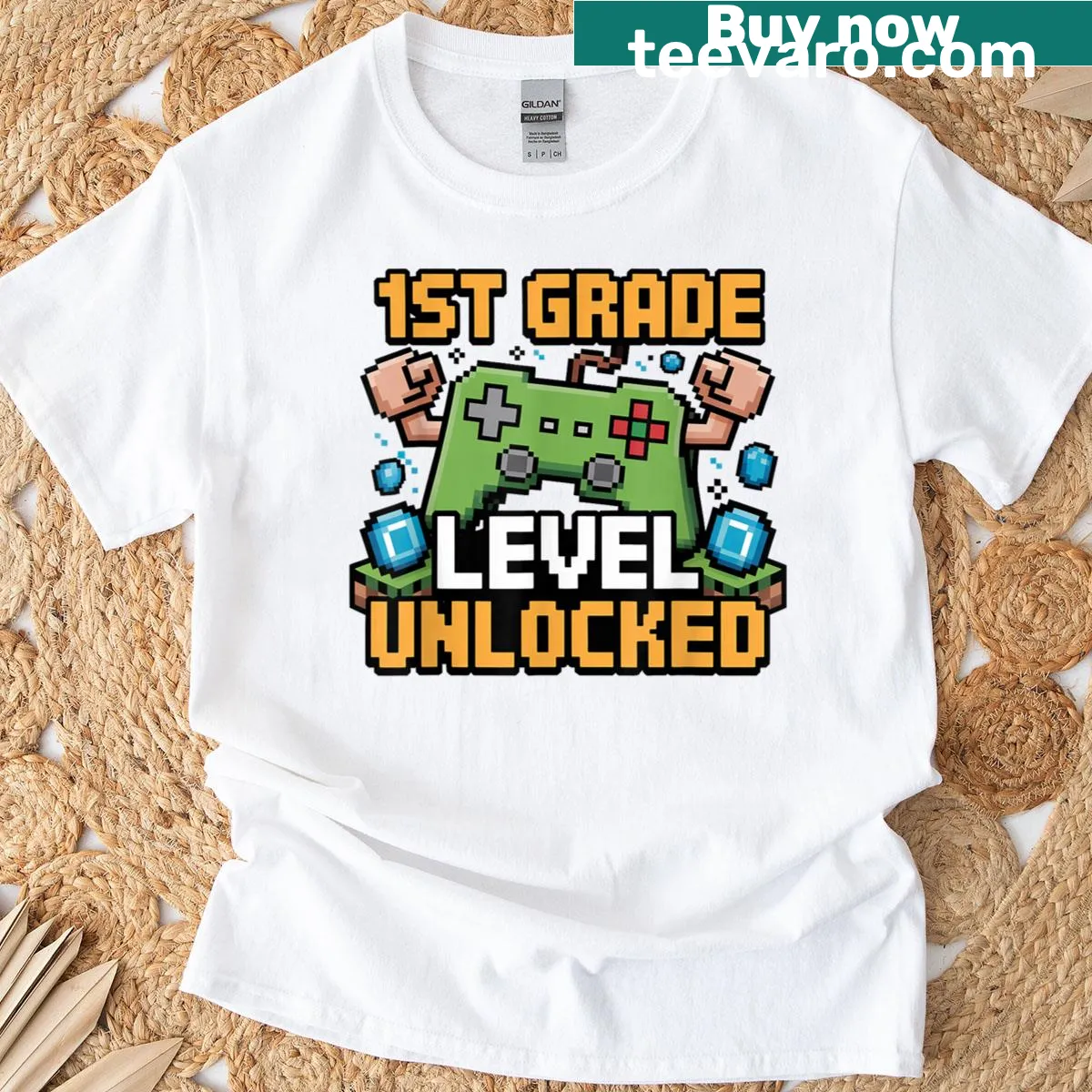 Illustrated dabbing character with 'First Grade Level Unlocked' text — on a men's t-shirt