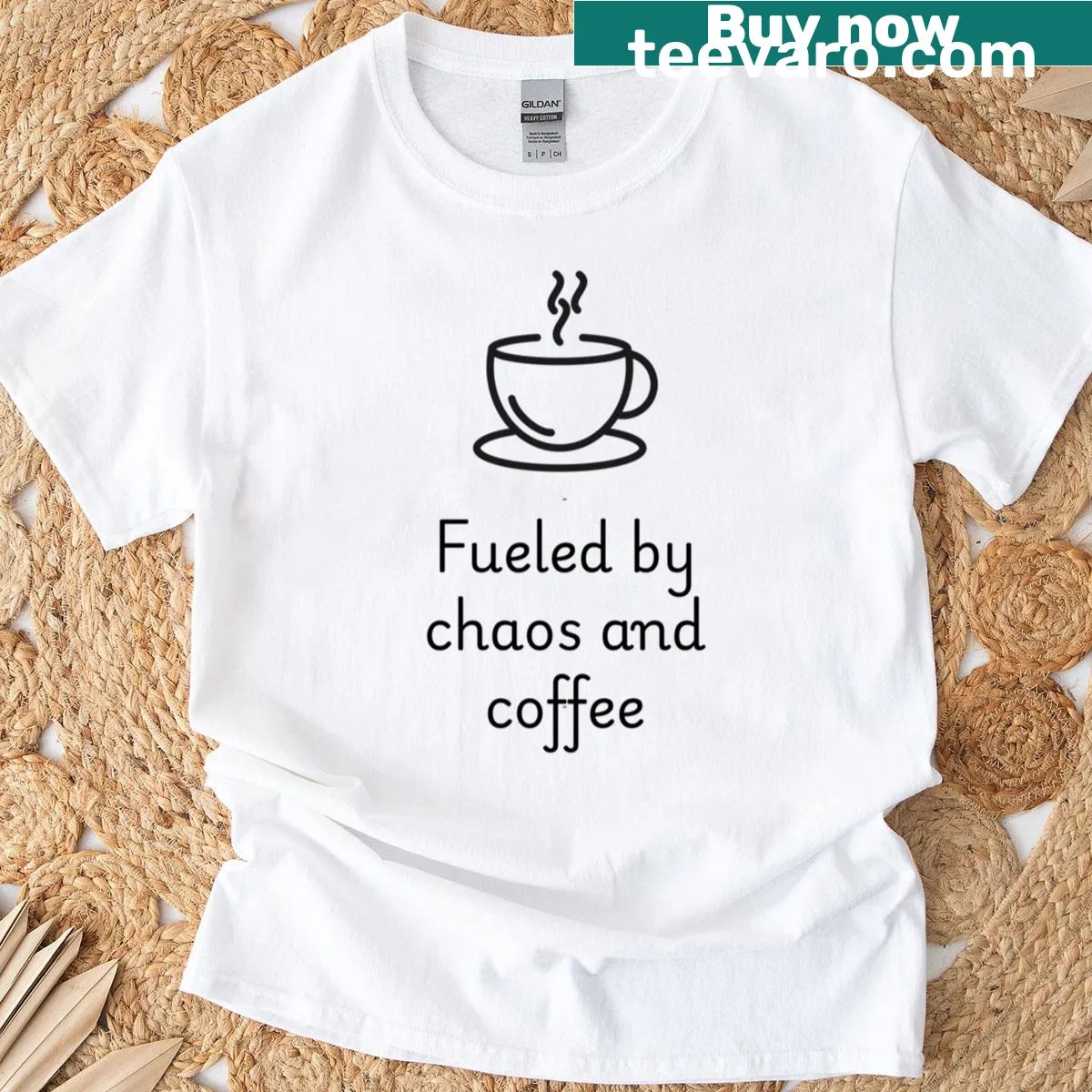 T-shirt with the phrase 'Fueled By Chaos And Coffee' in creative typography. — on a men's t-shirt