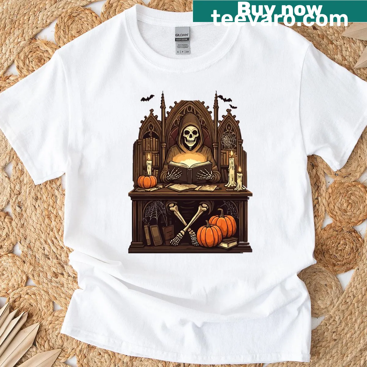 Illustrated skeleton reading a spellbook for Halloween design — on a men's t-shirt