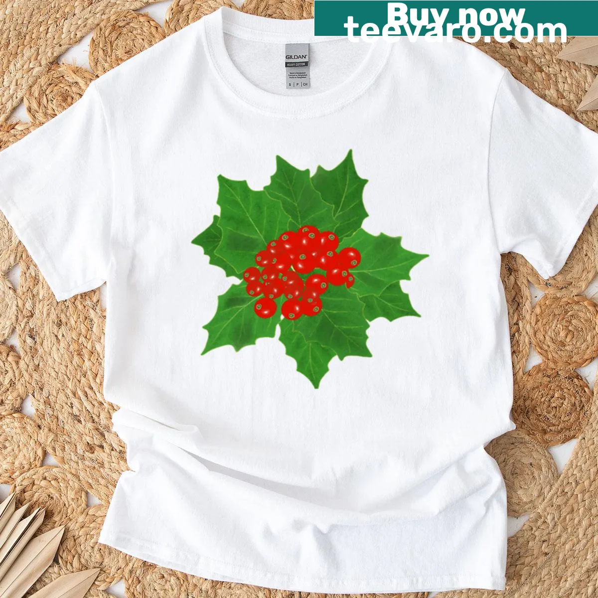 Illustrated T-shirt featuring holly leaves and berries design — on a men's t-shirt