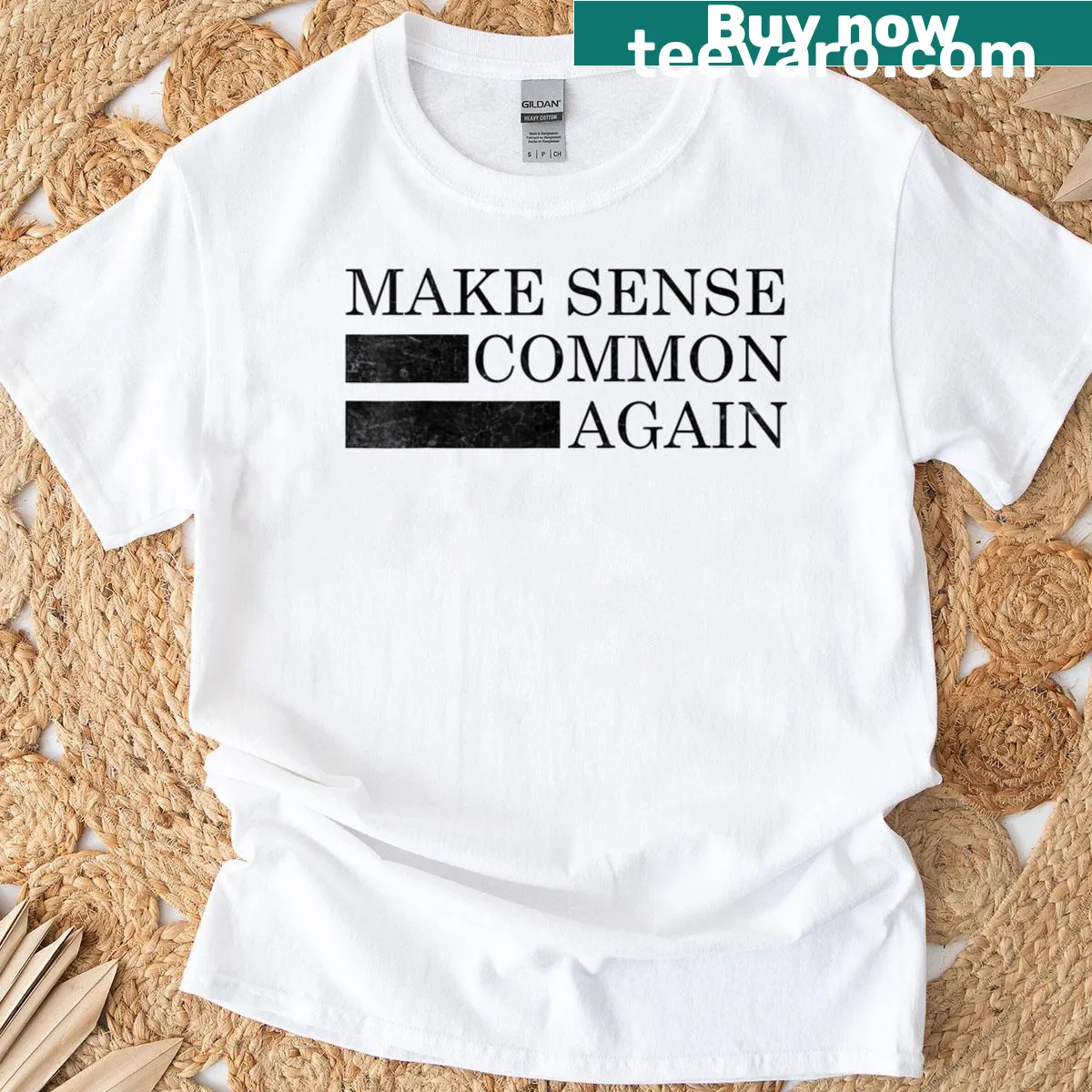 Minimalist distressed t-shirt with 'Make Sense Common Again' text — on a men's t-shirt