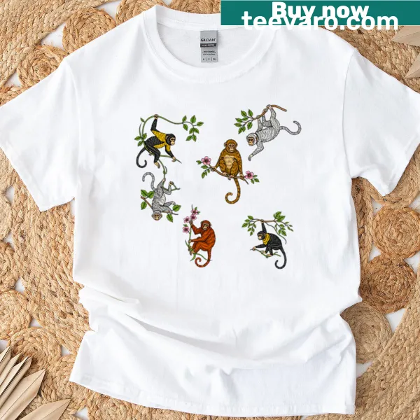Playful t-shirt featuring monkeys hanging from tree branches