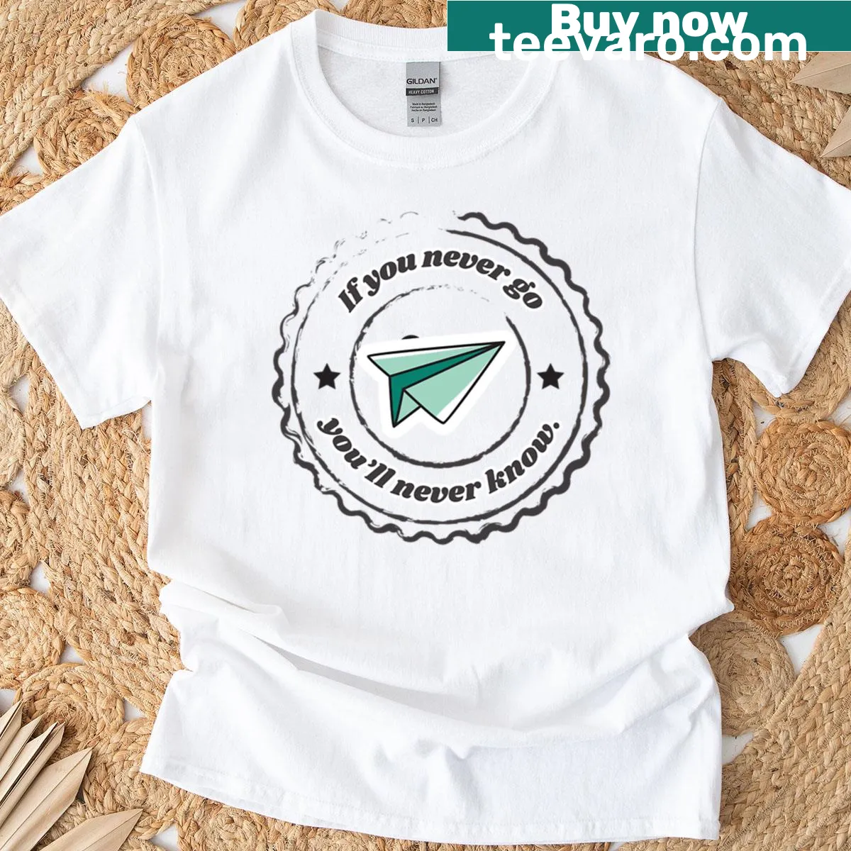 T-shirt featuring a paper plane design and wanderlust quote. — on a men's t-shirt