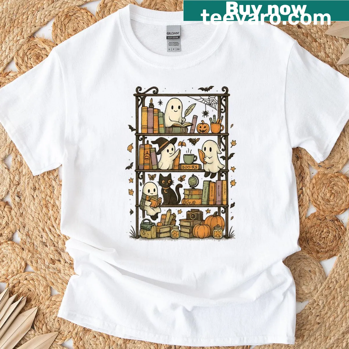 Illustrated t-shirt featuring ghost and cat on a bookshelf — on a men's t-shirt