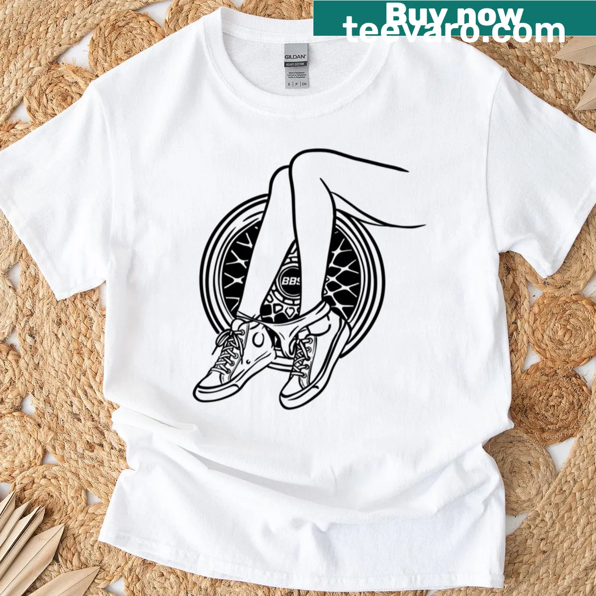 Modern line-art sneaker and car wheel graphic t-shirt design — on a men's t-shirt