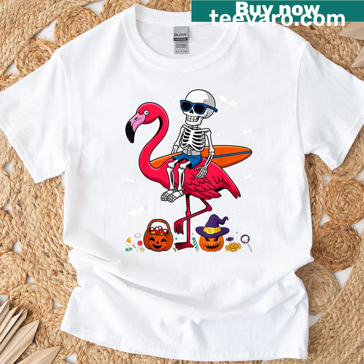 Skeleton surfing on flamingo Halloween T-shirt — on a men's t-shirt