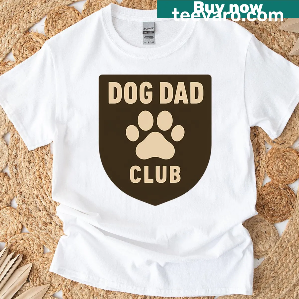 Oversized Dog Dad Club T-shirt with paw print badge design — on a men's t-shirt