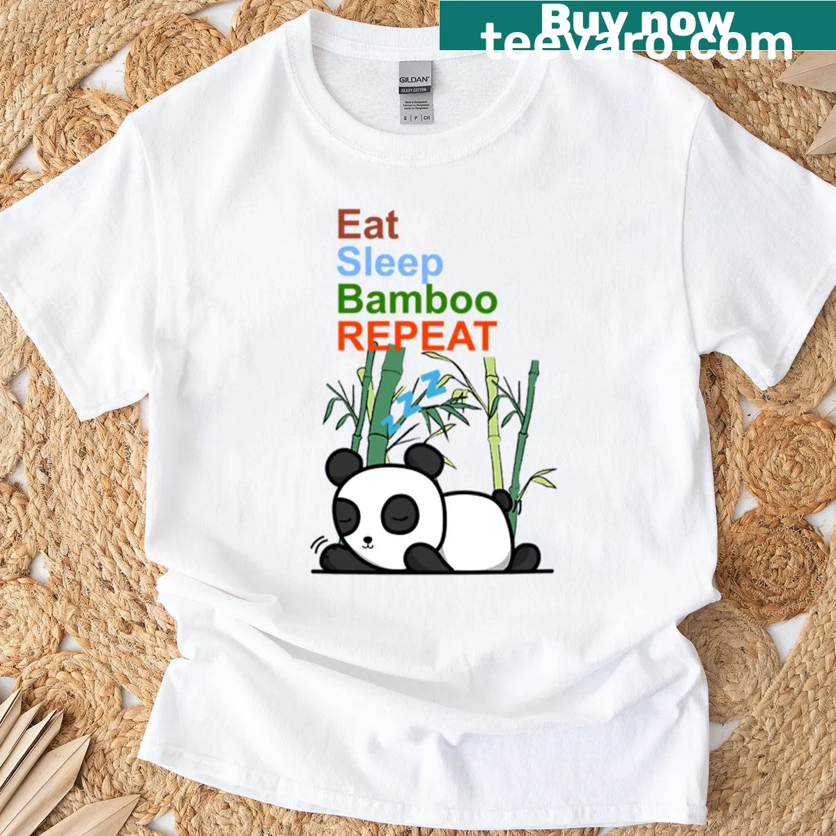 Cute panda graphic with text 'Eat Sleep Bamboo Repeat' on oversized t-shirt — on a men's t-shirt