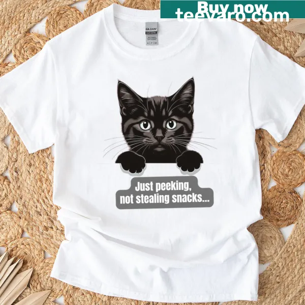 Black cat graphic with the text 'Just Peeking Not Stealing Snacks' on an oversized t-shirt