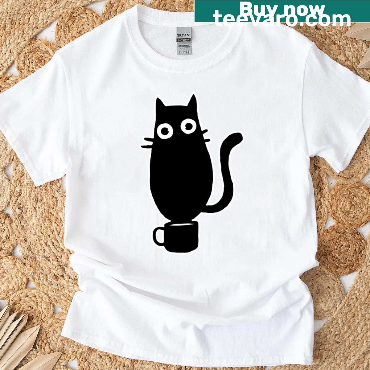 Hand-drawn illustration of a black cat on a cup with text — on a men's t-shirt