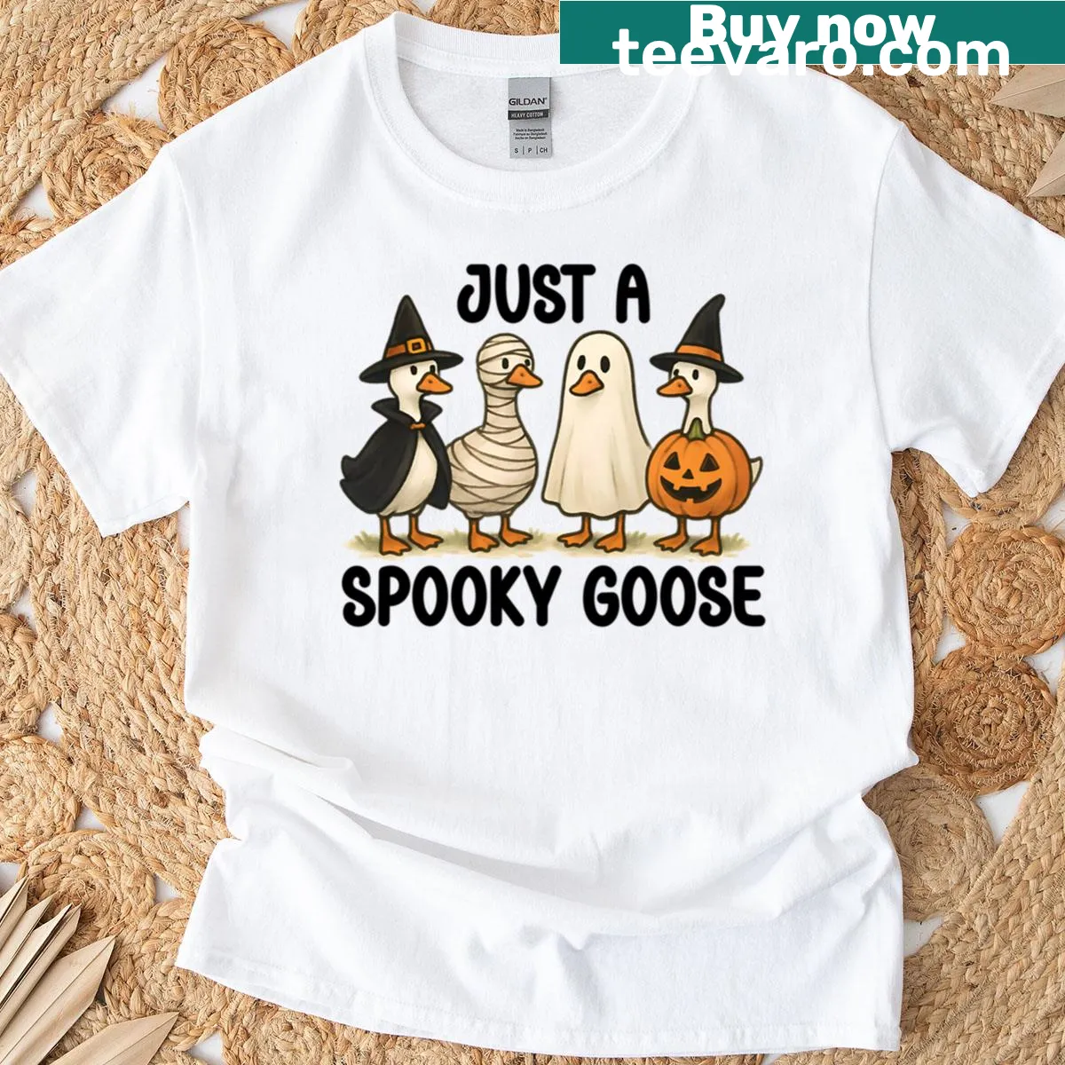 Playful goose graphic in costume on a Halloween-themed t-shirt — on a men's t-shirt