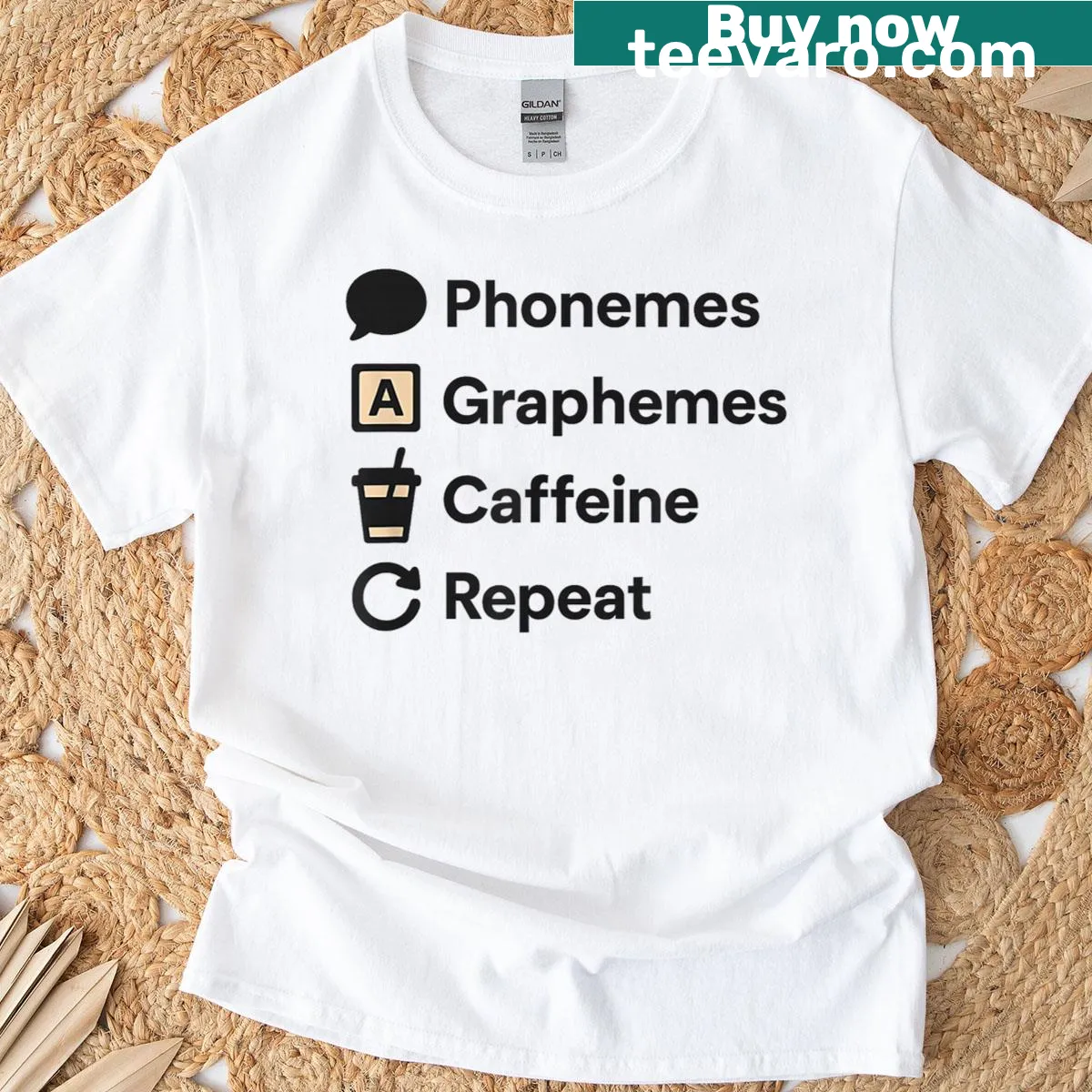 Teacher t-shirt with phonemes, graphemes, and coffee icons in a playful design — on a men's t-shirt
