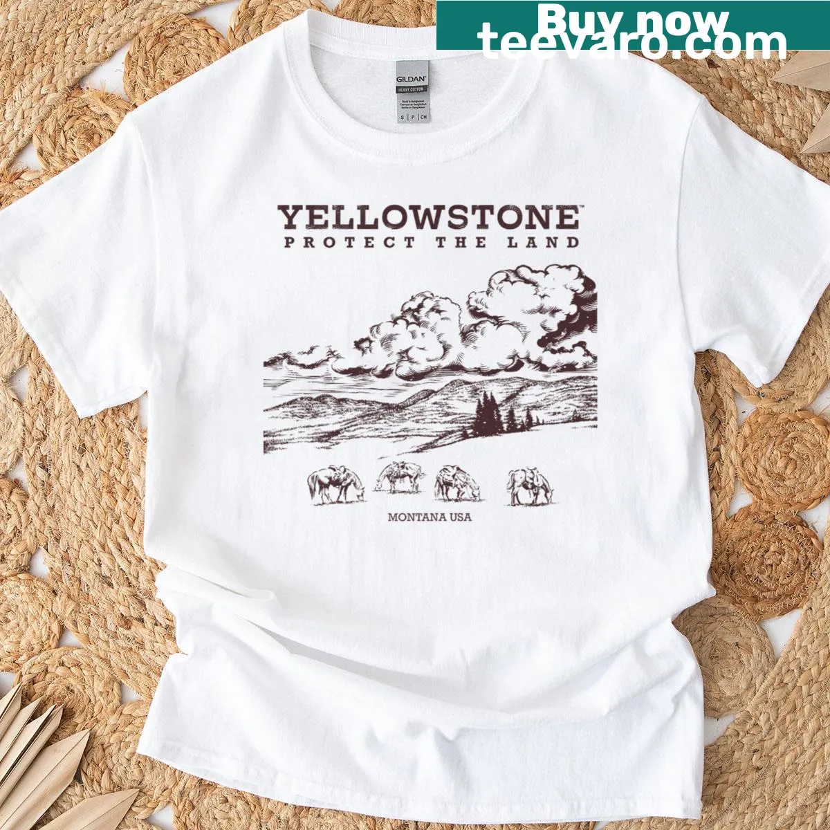 Distressed-style T-shirt featuring Yellowstone line art — on a men's t-shirt