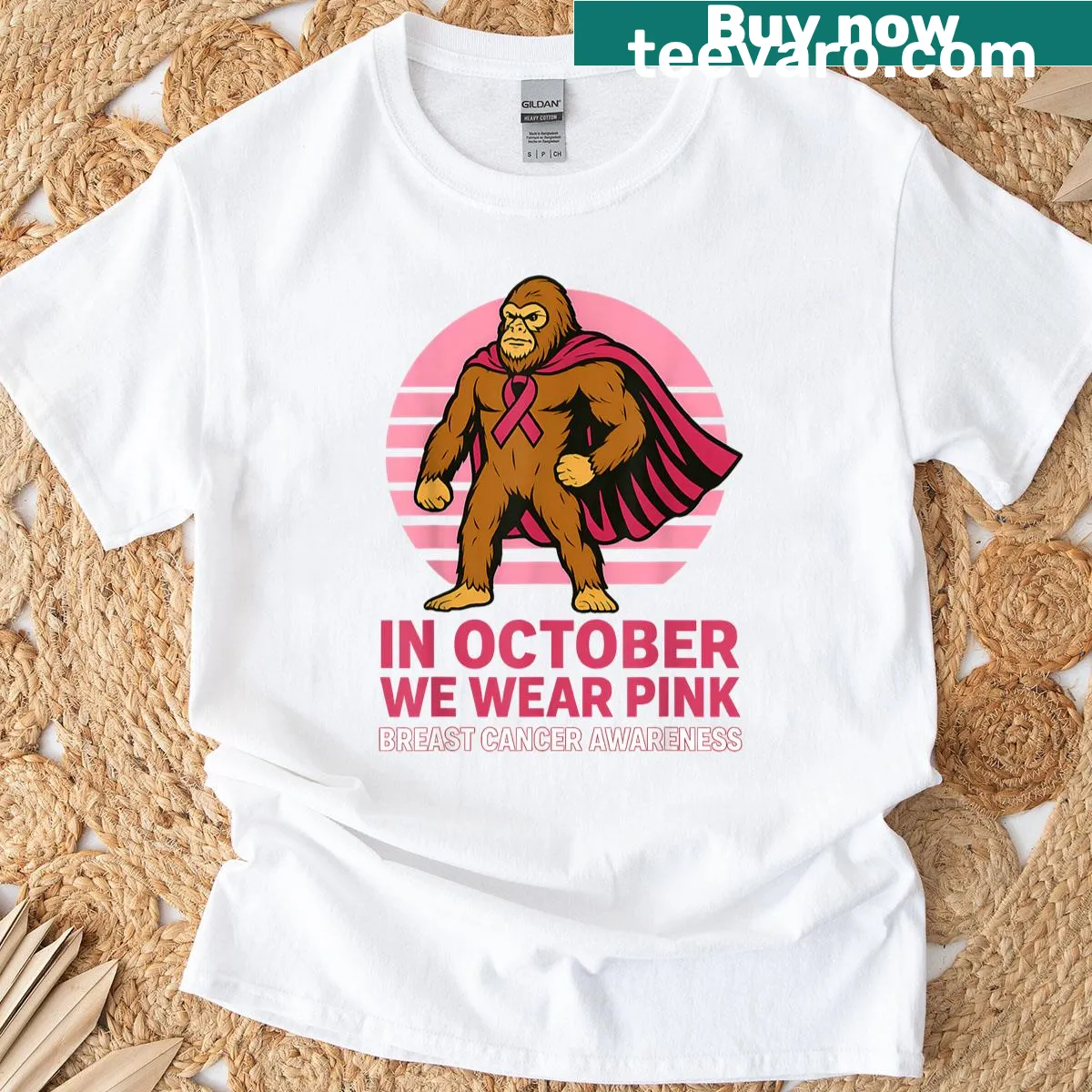 Illustrative T-shirt of a playful Bigfoot character for breast cancer awareness. — on a men's t-shirt