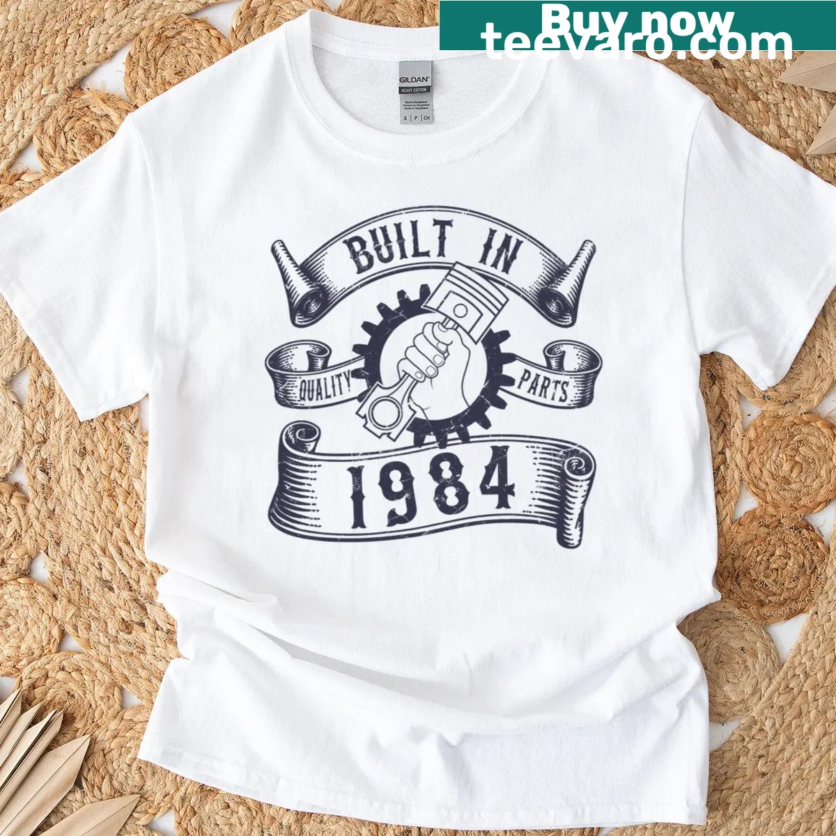 Graphic T-shirt for mechanics with piston design and 'Born in 1984' text — on a men's t-shirt