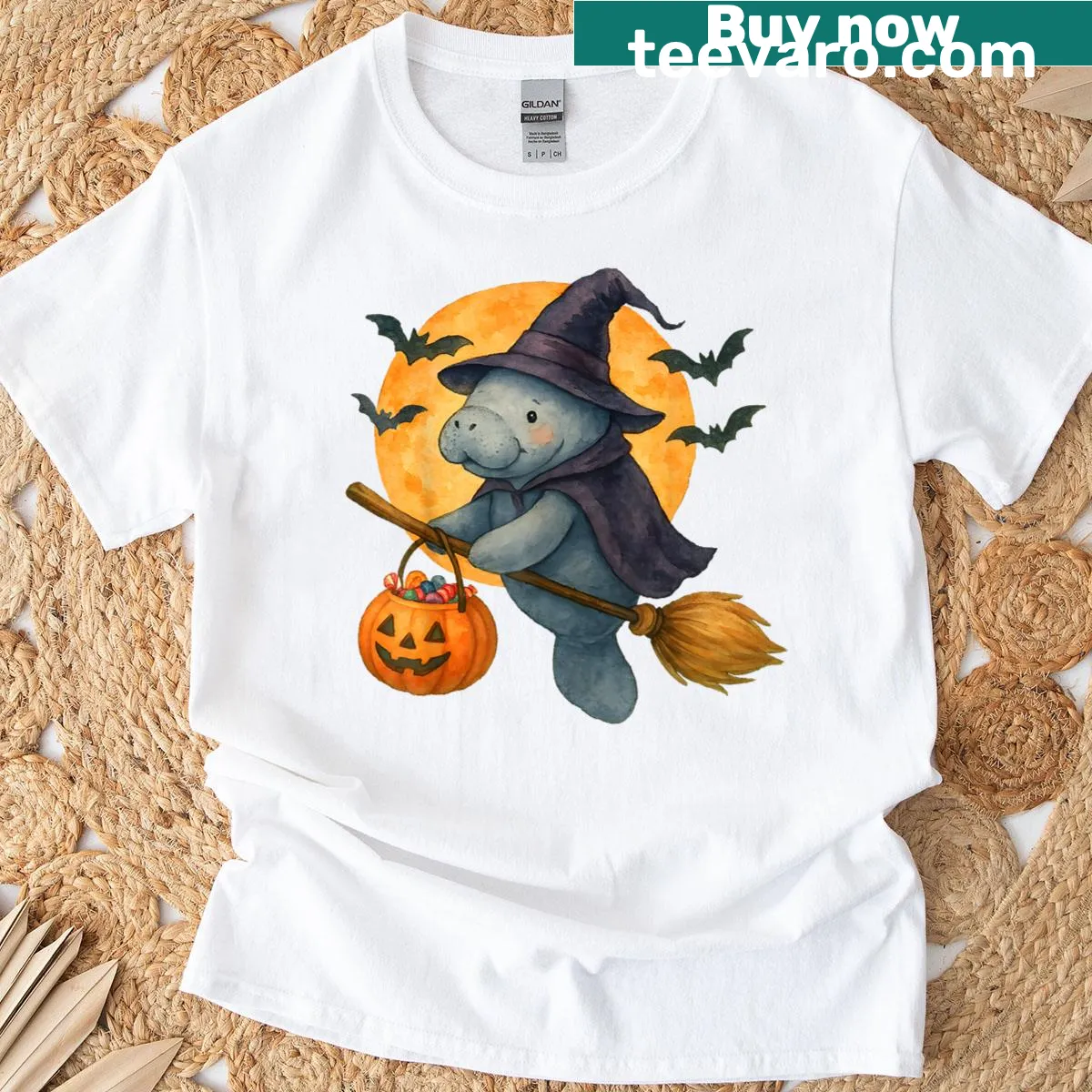 Cute manatee with witch hat and Halloween elements on a t-shirt — on a men's t-shirt