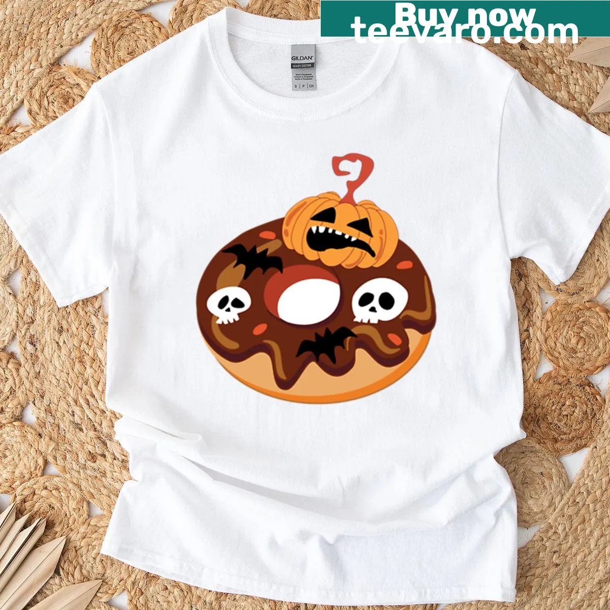Playful Halloween ghost with donut, pumpkins, skulls, and bats graphic — on a men's t-shirt
