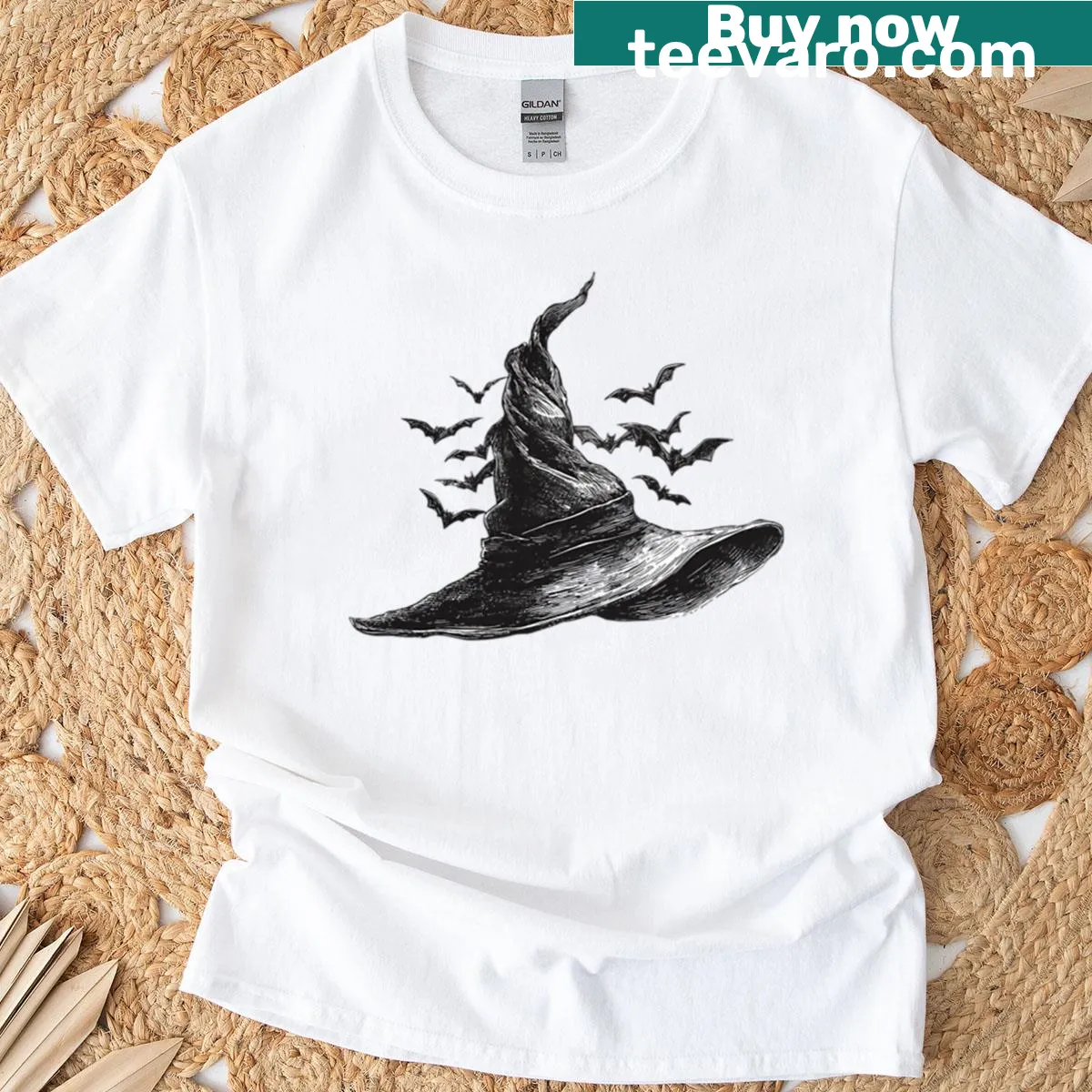 Vintage line art T-shirt featuring a witch hat and bats — on a men's t-shirt