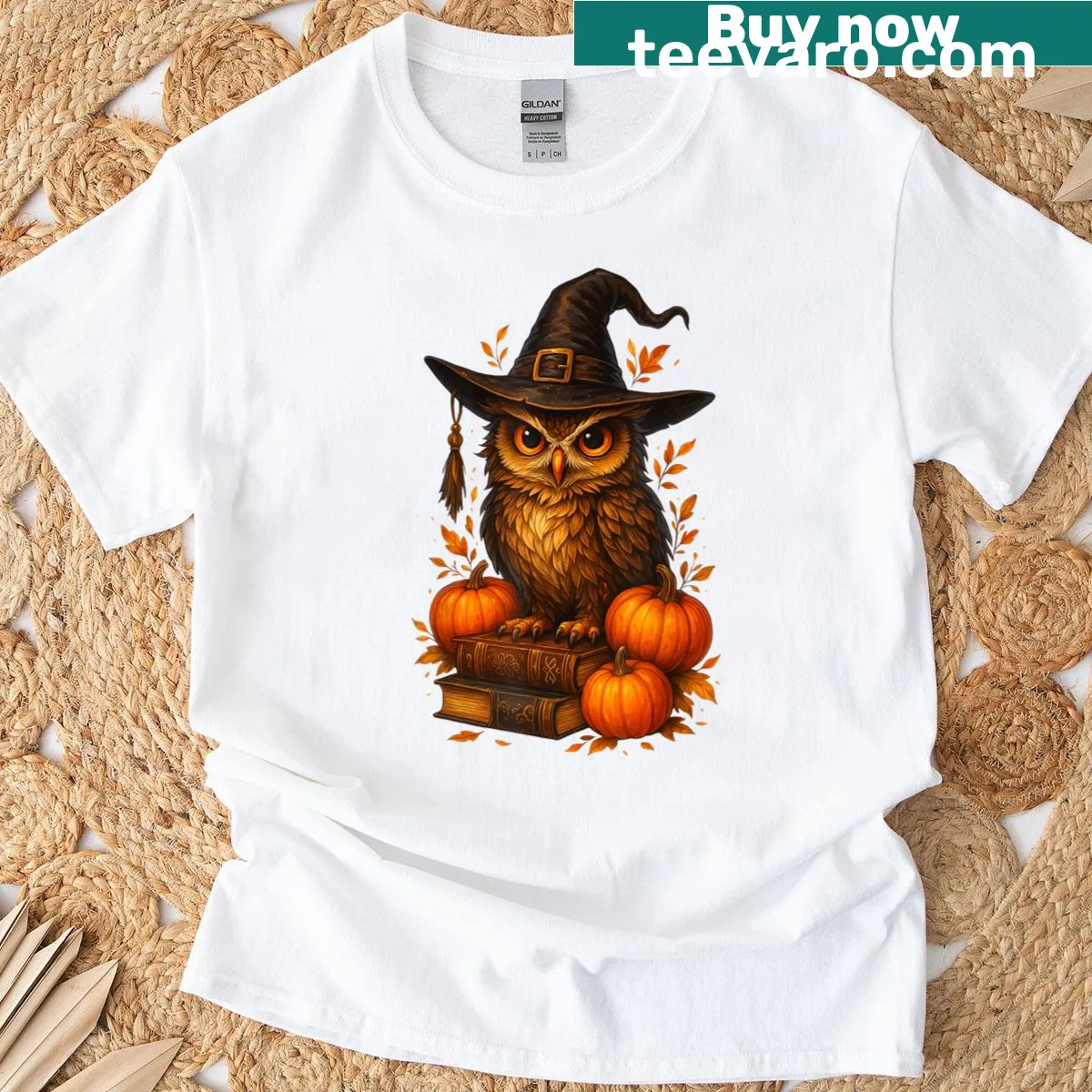Cottagecore T-shirt with an owl, witch hat, book, and pumpkins. — on a men's t-shirt
