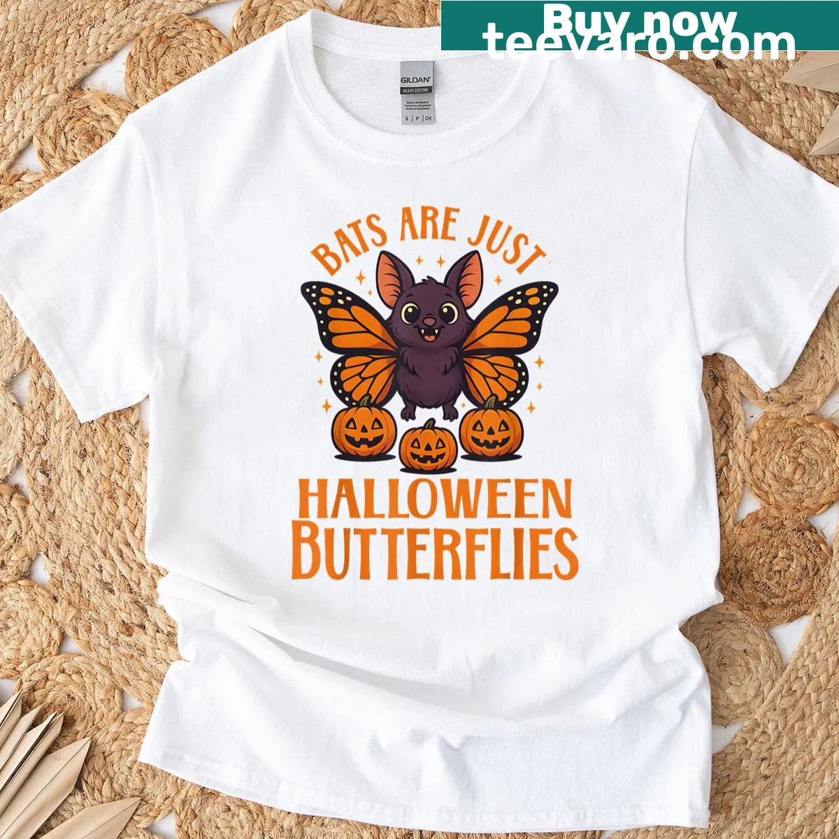 Whimsical bat and pumpkin graphic Halloween t-shirt — on a men's t-shirt
