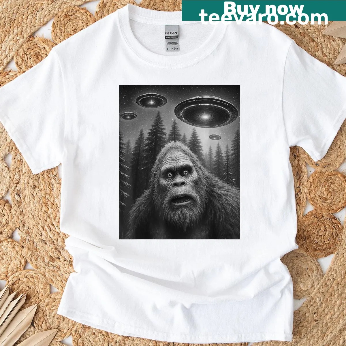 Humorous Bigfoot and UFO graphic T-shirt — on a men's t-shirt