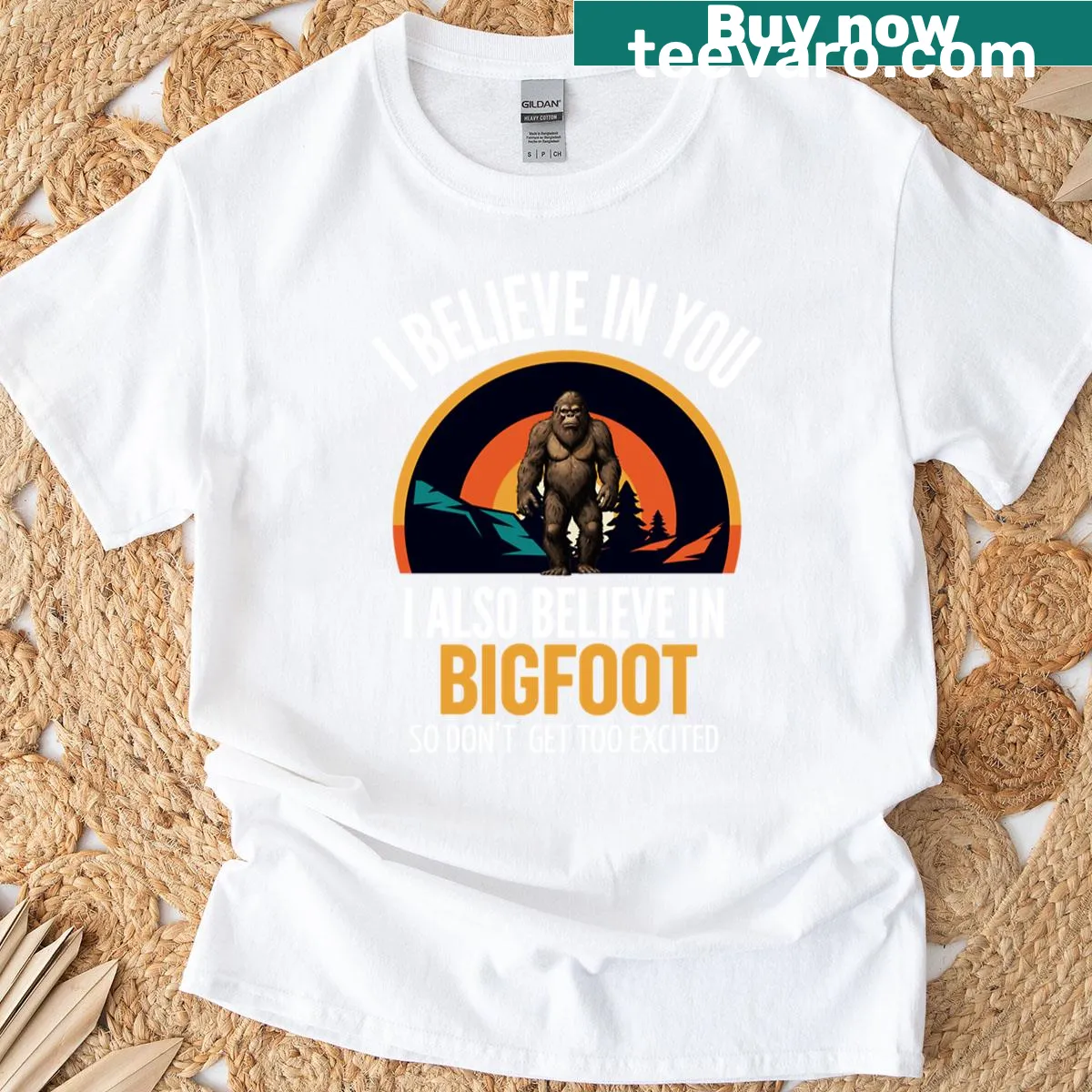 Retro Bigfoot t-shirt with whimsical forest and 'I Believe In You' text — on a men's t-shirt