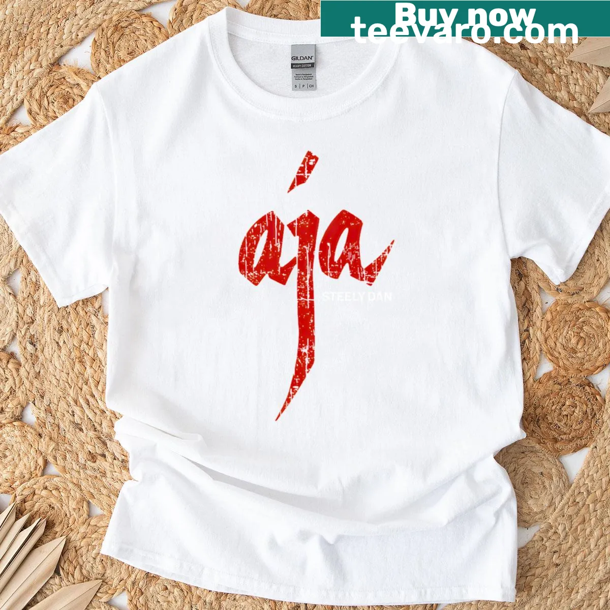 Vintage-style oversized t-shirt with distressed 'Aja' text — on a men's t-shirt