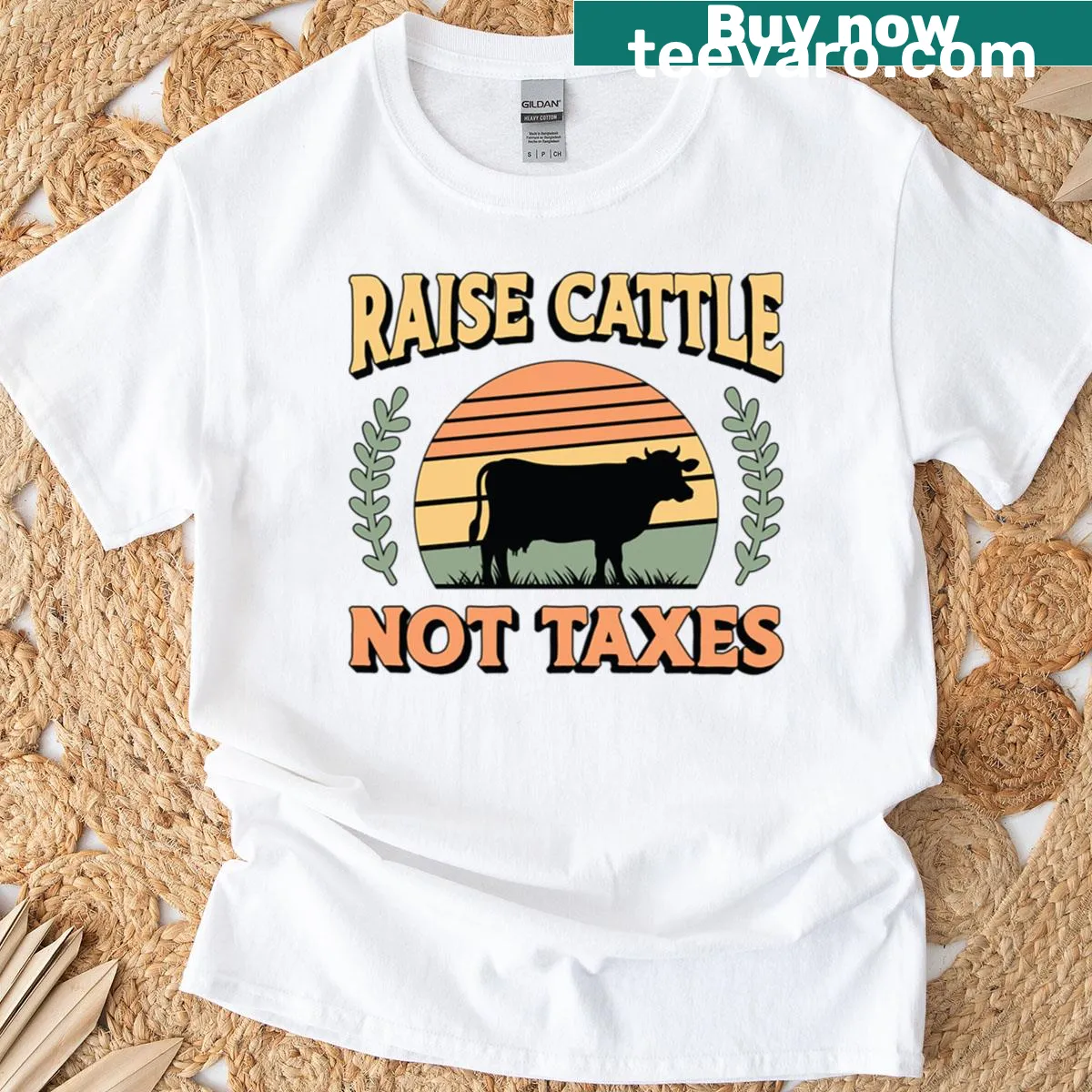 Oversized livestock breeder t-shirt with the phrase 'Raise Cattle Not Taxes.' — on a men's t-shirt