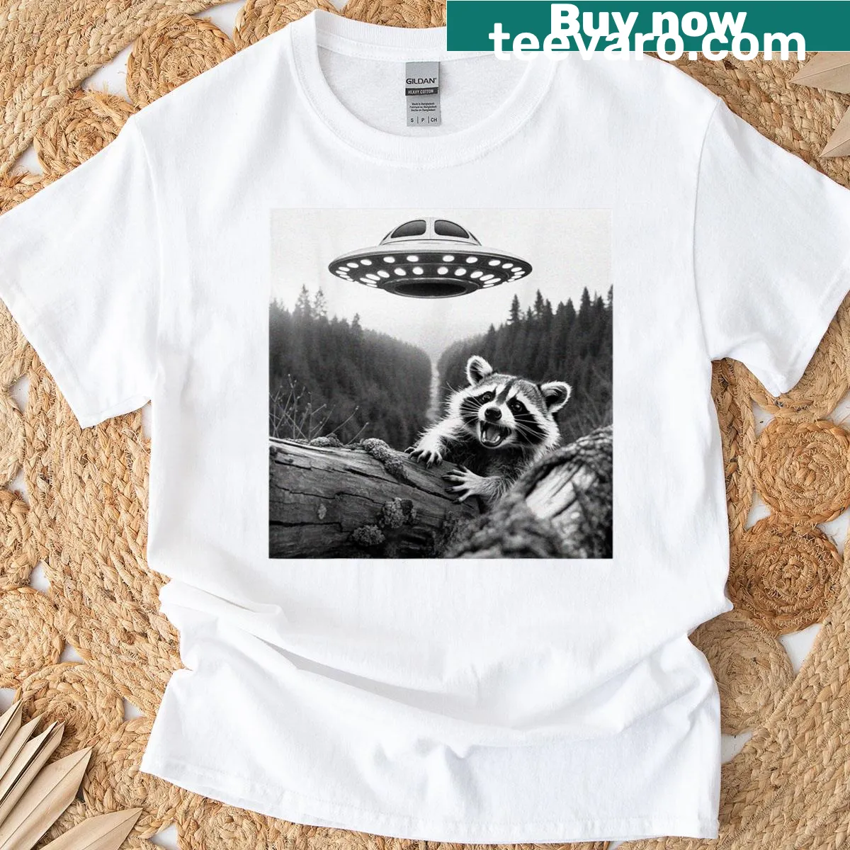 Raccoon escaping a UFO in a whimsical T-shirt design — on a men's t-shirt