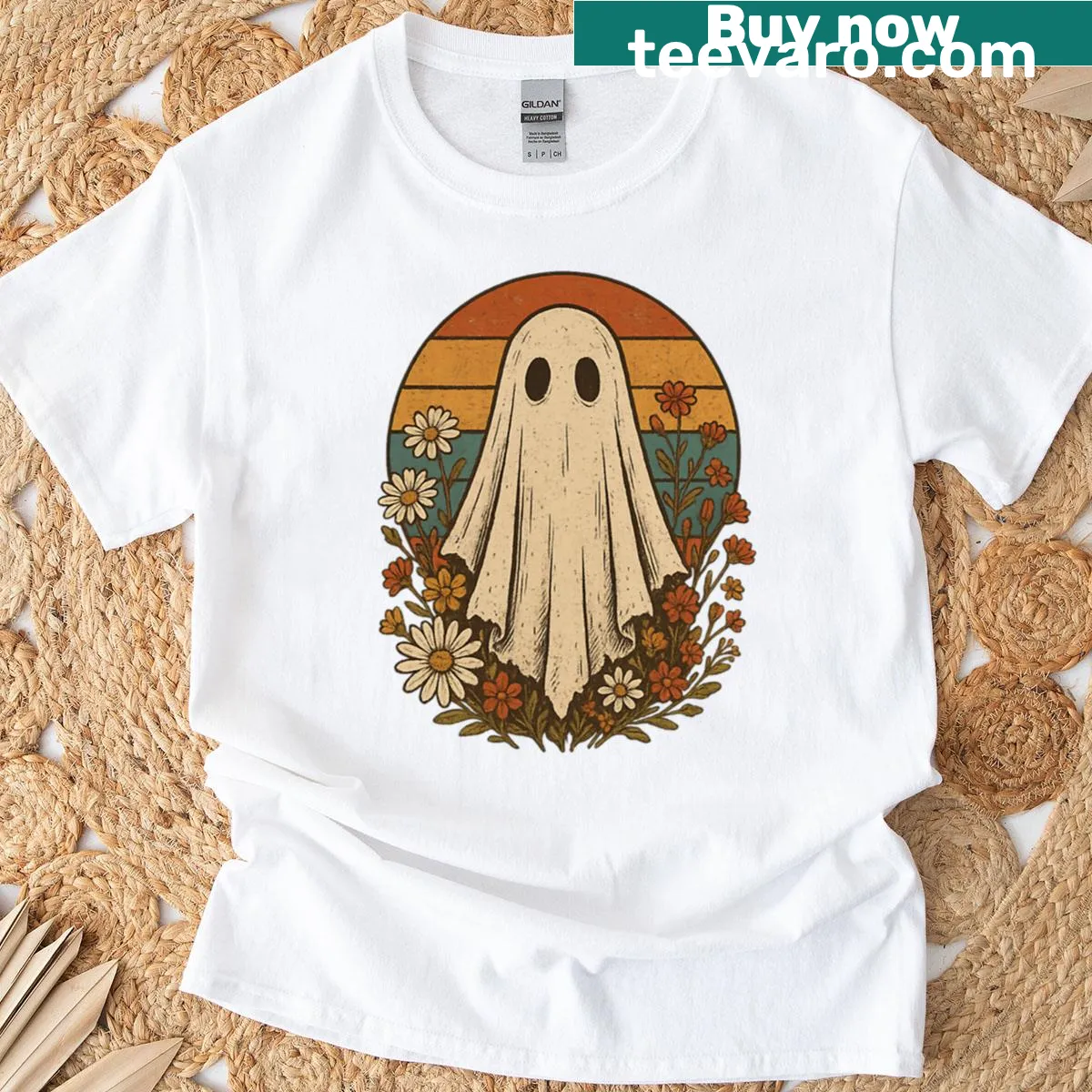 Vintage Halloween ghost graphic with floral accents on t-shirt. — on a men's t-shirt