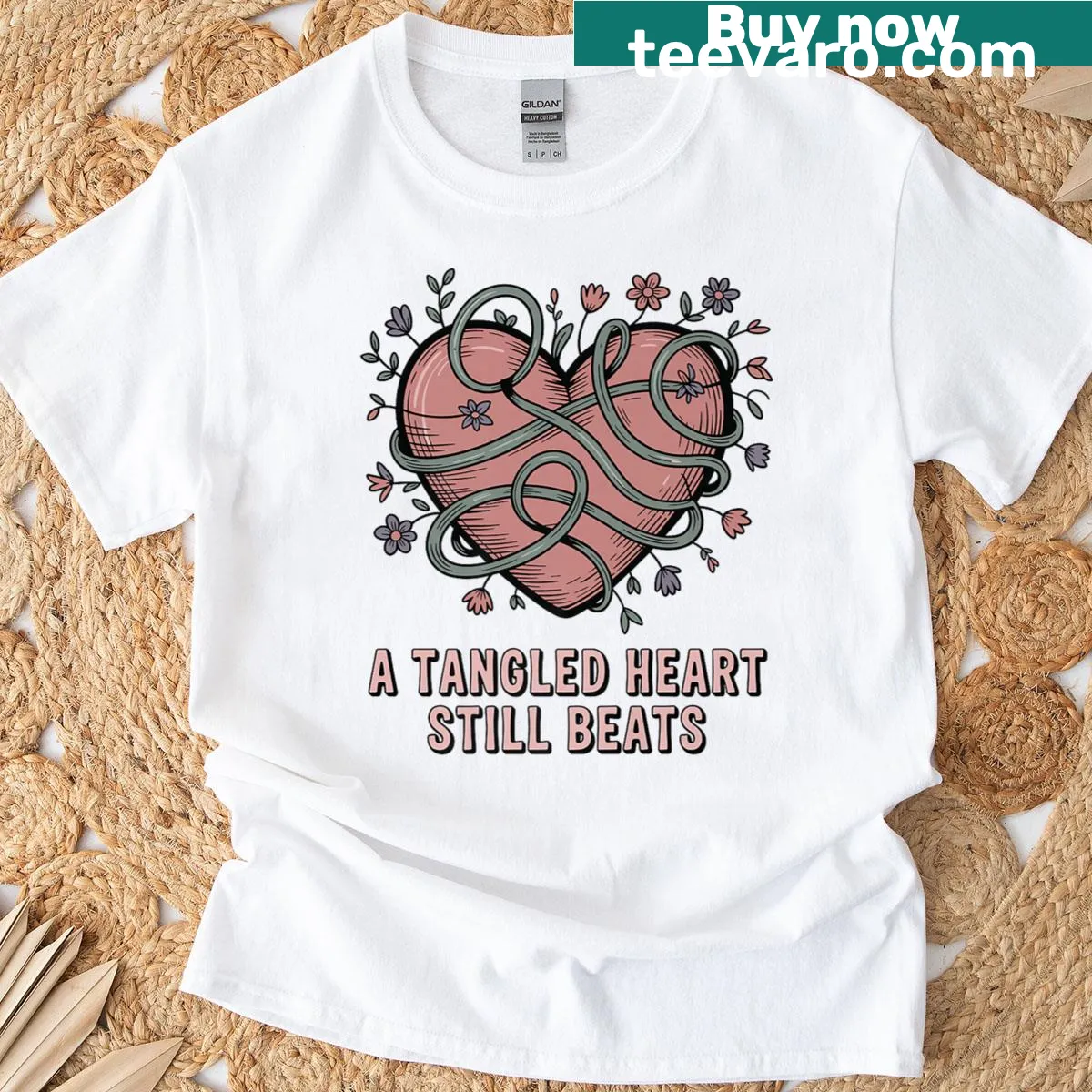 Inspirational t-shirt featuring the phrase 'A Tangled Heart Still Beats' — on a men's t-shirt