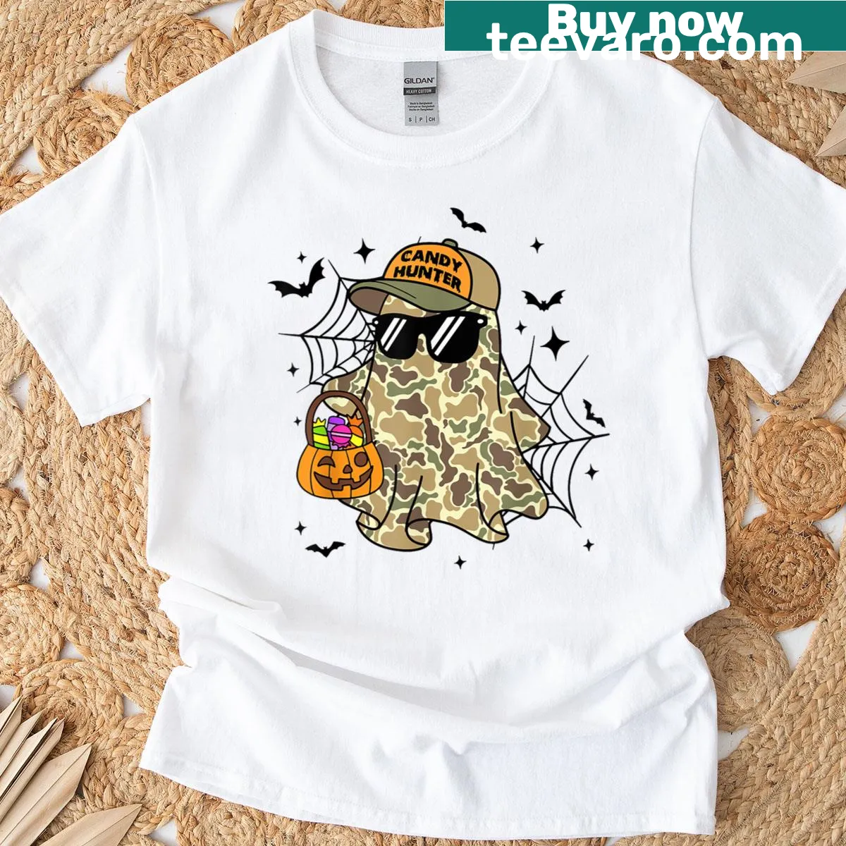 Halloween shirt with camo ghost and pumpkin design — on a men's t-shirt