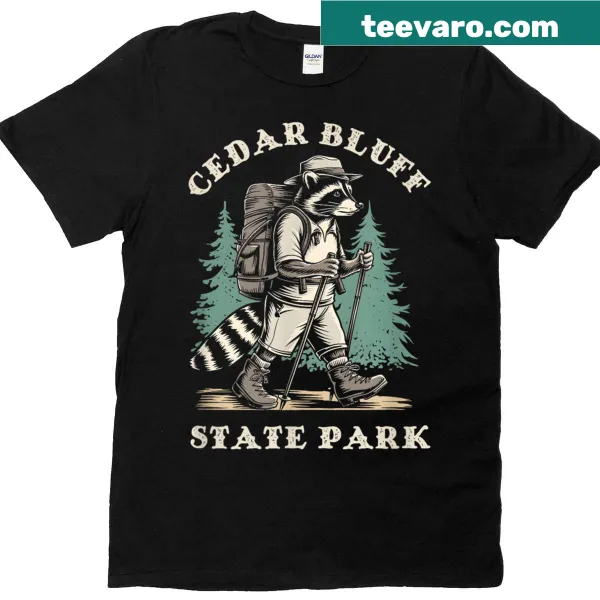 Whimsical t-shirt featuring a raccoon and Cedar Bluff State Park design